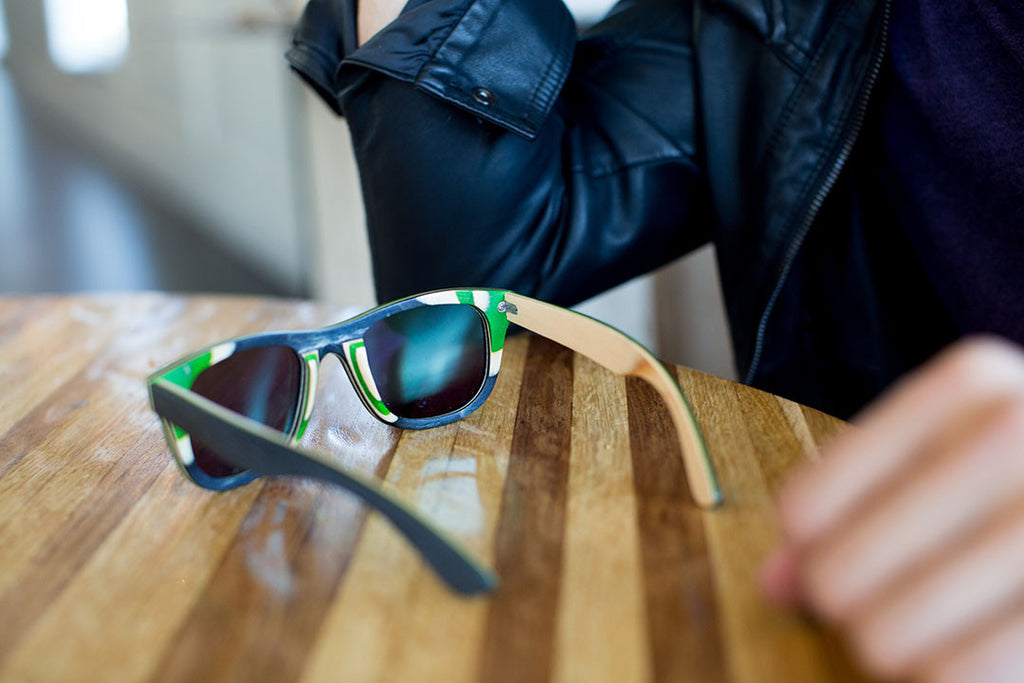 Black Skateboard Wood with Green Side Details and Reflective Green Polarized Lenses